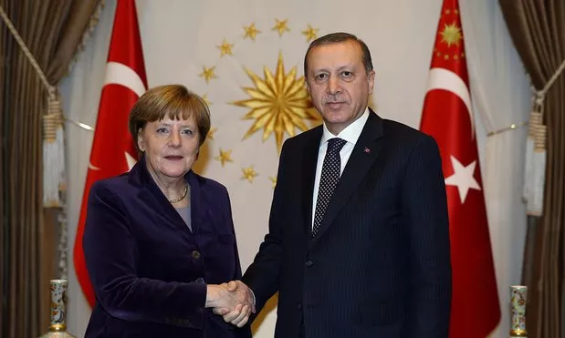 in this file photo german chancellor angela merkel shakes hand with turkish president recept tayyip erdogan photo courtesy the guardian in this file photo german chancellor angela merkel shakes hand with turkish president recept tayyip erdogan photo courtesy the guardian