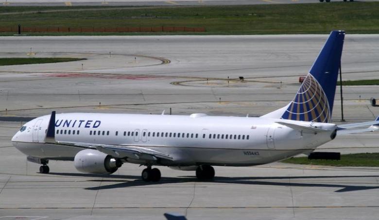 a united airlines plane with the continental airlines logo on its tail taxis to the runway at o 039 hare international airport in chicago photo reuters