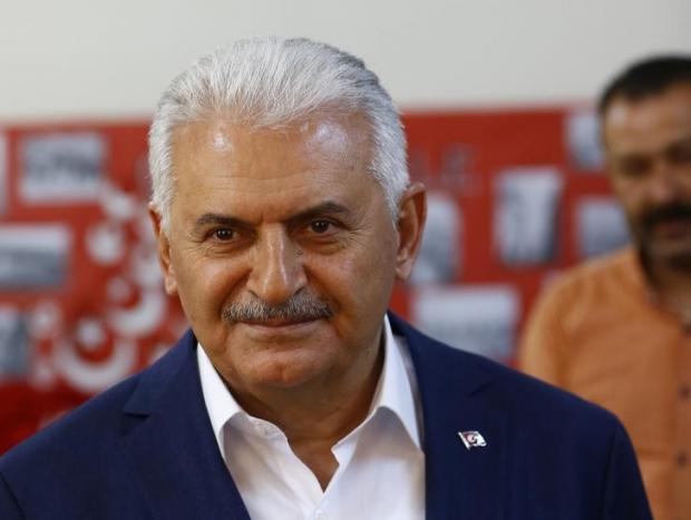 turkish prime minister binali yildirim looks on at a polling station during a referendum in the aegean port city of izmir turkey april 16 2017 photo reuters