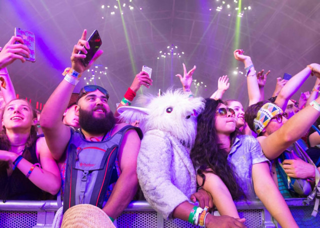 fans of dj khaled dance during his performance at the coachella valley music and arts festival on april 16 2017 in indio california photo afp