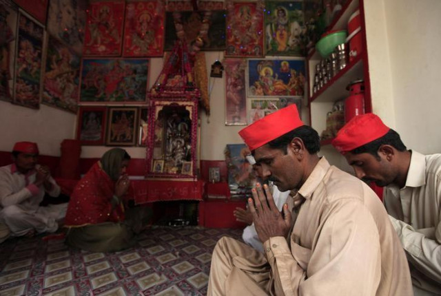 members of pakistan 039 s hindu community pray inside a temple in rahim yar khan photo reuters members of pakistan 039 s hindu community pray inside a temple in rahim yar khan photo reuters