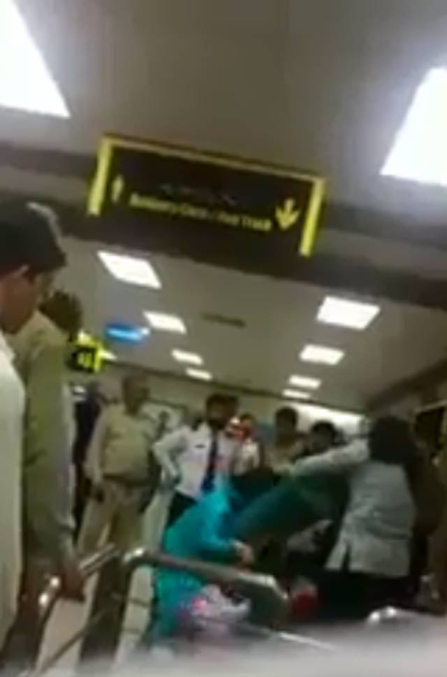 women can be heard screaming for help as other passengers and staffers watch fia officials thrash them video screengrab