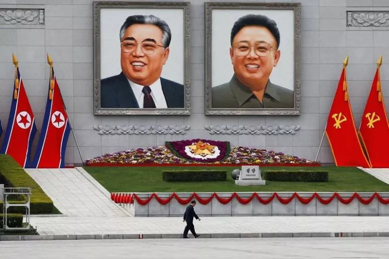 a man walks in front of portraits of north korea founder kim il sung and late leader kim jong il in central pyongyang north korea april 16 2017 photo reuters a man walks in front of portraits of north korea founder kim il sung and late leader kim jong il in central pyongyang north korea april 16 2017 photo reuters