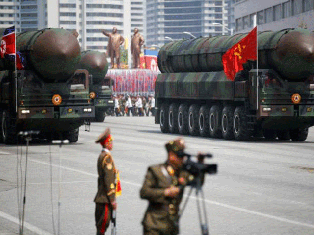 intercontinental ballistic missiles icbm are driven past the stand with north korean leader kim jong un and other high ranking officials during a military parade marking the 105th birth anniversary of country 039 s founding father kim il sung in pyongyang april 15 2017 photo reuters