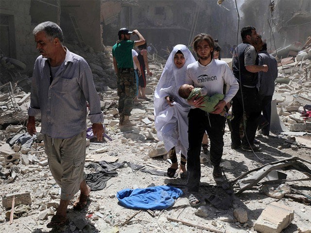 bombers at syria transit site disguised as aid workers un