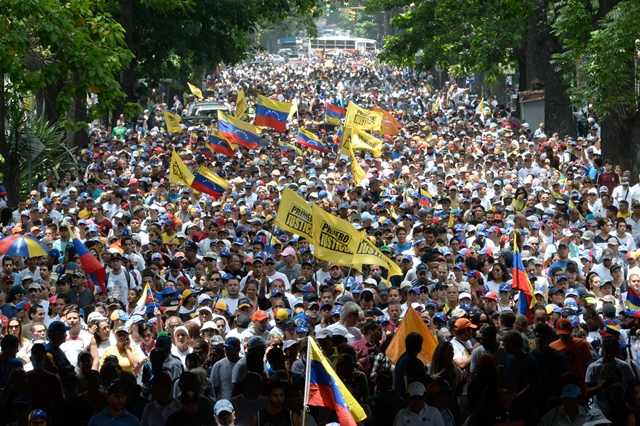 thousands of demonstrators rally against venezuelan president nicolas maduro in caracas on april 19 2017 photo afp