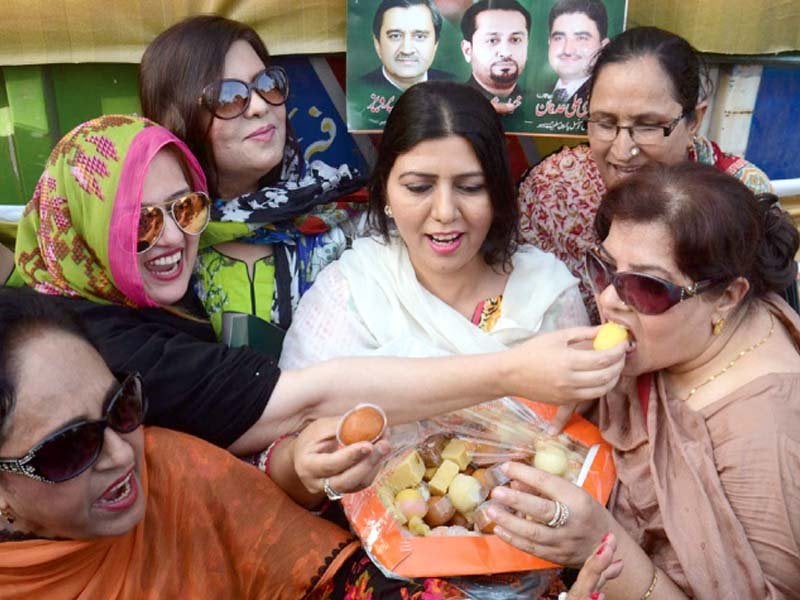 pml n workers dance exchange sweets and set off fireworks after panama case verdict photo agencies