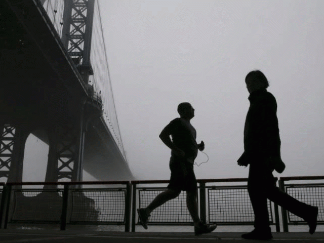 people are seen in silhouette exercising under the fog covered manhattan bridge in new york december 14 2015 photo reuters people are seen in silhouette exercising under the fog covered manhattan bridge in new york december 14 2015 photo reuters