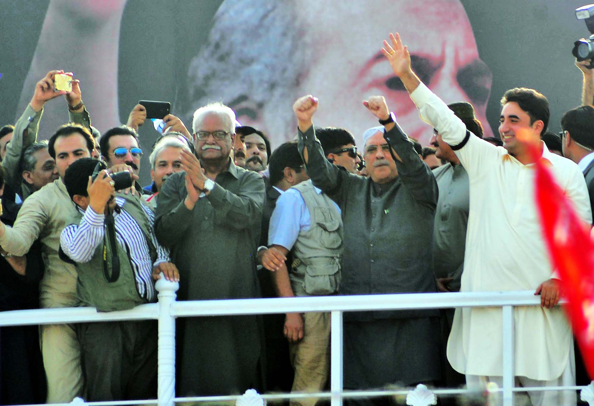 ppp chairman bilawal bhutto zardari and co chairman asif ali zardari wave at supporters in garhi khuda bux photo online file