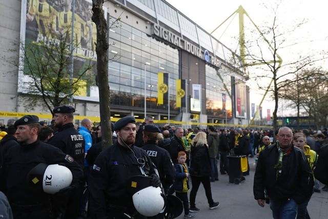 police patrol outide the stadium after the team bus of borussia dortmund had some windows broken by an explosion some 10km away from the stadium prior to the uefa champions league 1st leg quarter final football match bvb borussia dortmund v monaco in dortmund western germany on april 11 2017 photo afp police patrol outide the stadium after the team bus of borussia dortmund had some windows broken by an explosion some 10km away from the stadium prior to the uefa champions league 1st leg quarter final football match bvb borussia dortmund v monaco in dortmund western germany on april 11 2017 photo afp