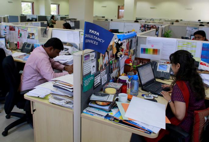 employees of tata consultancy services tcs work inside the company headquarters in mumbai india photo reuters