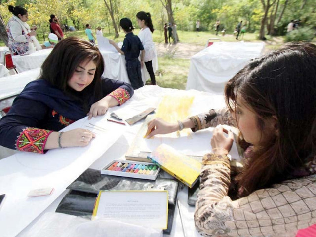 girls making posters for a competition organised to mark world health day in islamabad photo online girls making posters for a competition organised to mark world health day in islamabad photo online