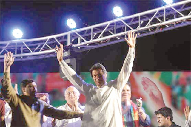 imran khan waves at the crowd before addressing the public gathering in dadu photo online imran khan waves at the crowd before addressing the public gathering in dadu photo online