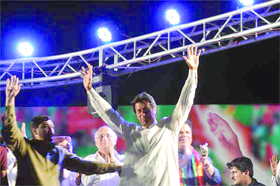 imran khan waves at the crowd before addressing the public gathering in dadu photo online