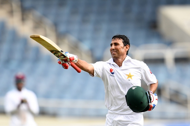 younis khan celebrates after reaching his 10 000th run in test matches on day three of the first test match between west indies and pakistan photo afp