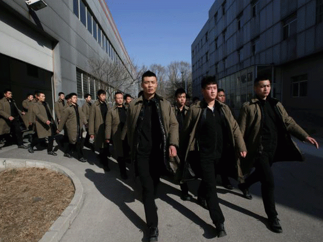 trainees from dewei security walk for a daily training session at a training camp on the outskirts of beijing china march 2 2017 photo reuters trainees from dewei security walk for a daily training session at a training camp on the outskirts of beijing china march 2 2017 photo reuters