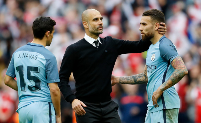 manchester city manager pep guardiola jesus navas and nicolas otamendi look dejected after defeat against arsenal on april 24 2017 photo reuters manchester city manager pep guardiola jesus navas and nicolas otamendi look dejected after defeat against arsenal on april 24 2017 photo reuters
