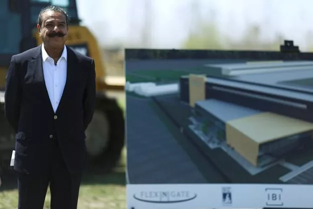 owner and businessman shahid khan stands alongside an artist 039 s rendering of the flex n gate manufacturing facility during a ground breaking ceremony at the site in the i 94 industrial park in detroit michigan us april 24 2017 photo reuters owner and businessman shahid khan stands alongside an artist 039 s rendering of the flex n gate manufacturing facility during a ground breaking ceremony at the site in the i 94 industrial park in detroit michigan us april 24 2017 photo reuters