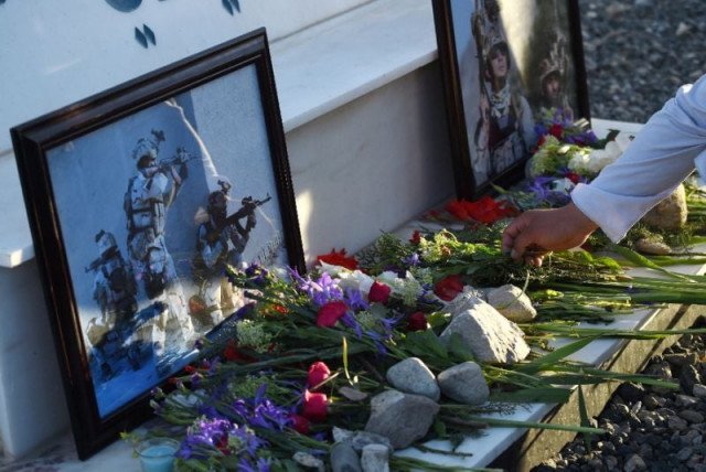 afghan activists pay tribute to the victims of a taliban attack on an army base at a memorial on the wazir akbar khan hilltop in kabul on april 23 2017 photo afp afghan activists pay tribute to the victims of a taliban attack on an army base at a memorial on the wazir akbar khan hilltop in kabul on april 23 2017 photo afp