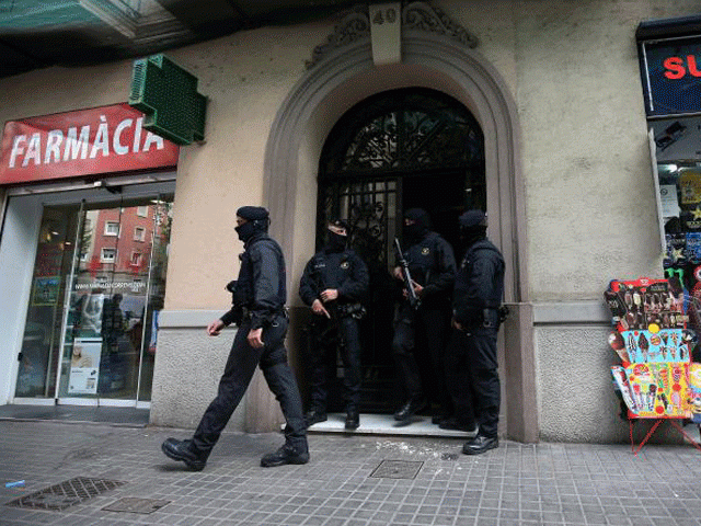 spanish police stand guard outside an apartment building during a sweeping operation at some 12 locations against militants in which eight people were arrested in barcelona spain april 25 2017 photo reuters spanish police stand guard outside an apartment building during a sweeping operation at some 12 locations against militants in which eight people were arrested in barcelona spain april 25 2017 photo reuters
