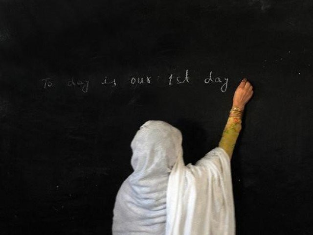 the government is devising an independent monitoring system to ensure the attendance of teachers in schools photo afp