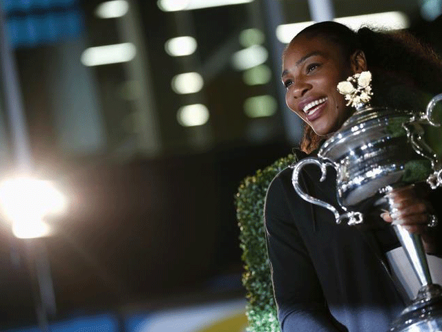 serena williams of the us poses with the women 039 s singles trophy after winning her final match photo reuters