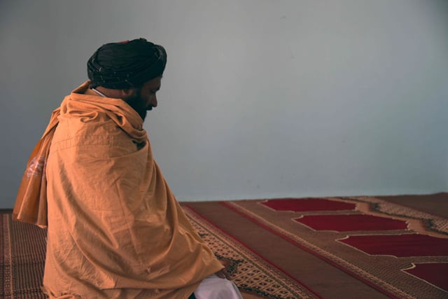 in this photograph taken on march 22 2017 former afghan taliban commander maulvi abdul rauf 37 offers prayers inside a mosque in the panjwayi district of kandahar province photo afp in this photograph taken on march 22 2017 former afghan taliban commander maulvi abdul rauf 37 offers prayers inside a mosque in the panjwayi district of kandahar province photo afp