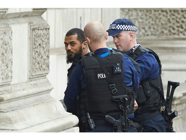 firearms officers from the british police detain a man on whitehall near the houses of parliament in central london on april 27 2017 before being taken away by police photo afp firearms officers from the british police detain a man on whitehall near the houses of parliament in central london on april 27 2017 before being taken away by police photo afp