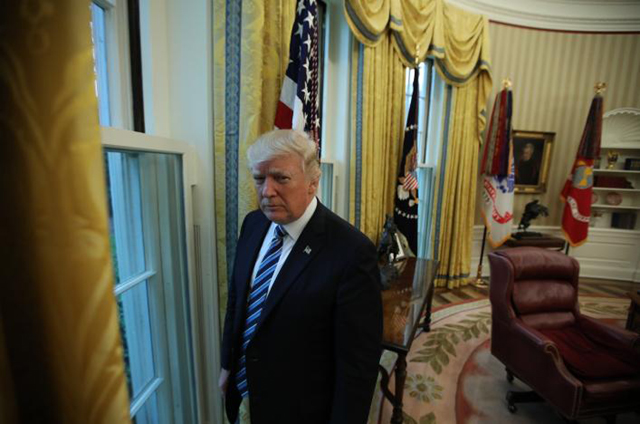 us president donald trump stands in the oval office following an interview with reuters at the white house in washington us april 27 2017 photo reuters