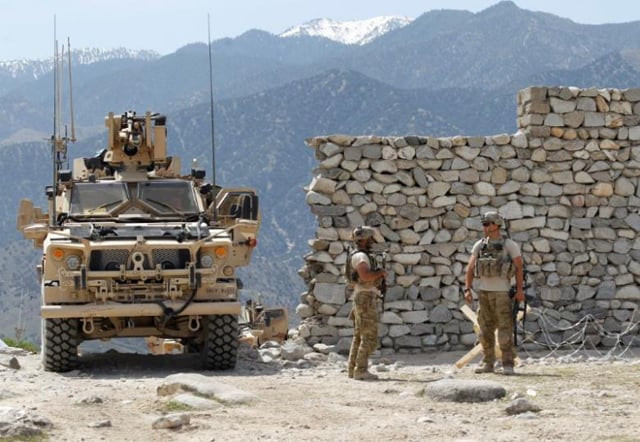 us soldiers stand guard near the site of a us bombing in the achin district of nangarhar province in eastern afghanistan april 15 2017 photo reuters us soldiers stand guard near the site of a us bombing in the achin district of nangarhar province in eastern afghanistan april 15 2017 photo reuters