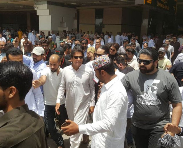 pakistan tehreek e insaf chairman iman khan arrives at jinnah international airport in karachi on sunday april 30 2017 photo twitter com ptiofficial