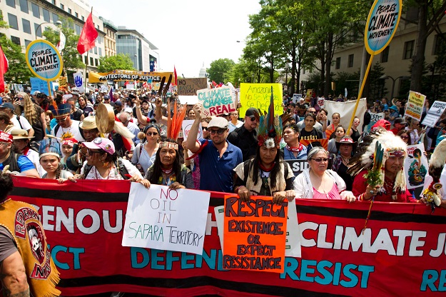 us actor leonardo dicaprio c marches with a group of indigenous people from north and south america during the people 039 s climate march in washington dc on april 29 2017 photo afp