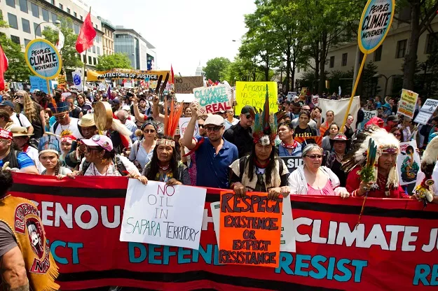 us actor leonardo dicaprio c marches with a group of indigenous people from north and south america during the people 039 s climate march in washington dc on april 29 2017 photo afp us actor leonardo dicaprio c marches with a group of indigenous people from north and south america during the people 039 s climate march in washington dc on april 29 2017 photo afp