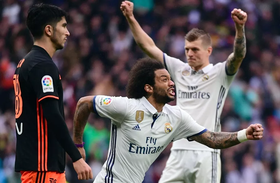 real madrid 039 s brazilian defender marcelo c celebrates a goal during the spanish league football match real madrid cf vs valencia cf at the santiago bernabeu stadium in madrid on april 29 2017 photo afp real madrid 039 s brazilian defender marcelo c celebrates a goal during the spanish league football match real madrid cf vs valencia cf at the santiago bernabeu stadium in madrid on april 29 2017 photo afp