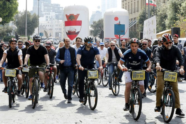 lebanese prime minister saad hariri c rides a bike at an event to launch a public bicycle sharing system in beirut on april 30 2017 photo afp lebanese prime minister saad hariri c rides a bike at an event to launch a public bicycle sharing system in beirut on april 30 2017 photo afp