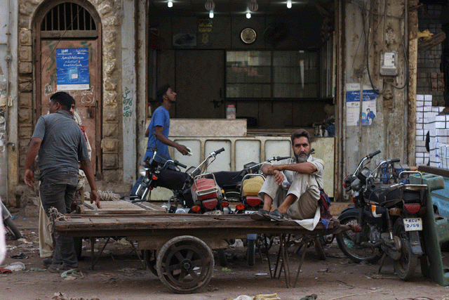 a labourer sits on his cart photo fawad hasan a labourer sits on his cart photo fawad hasan