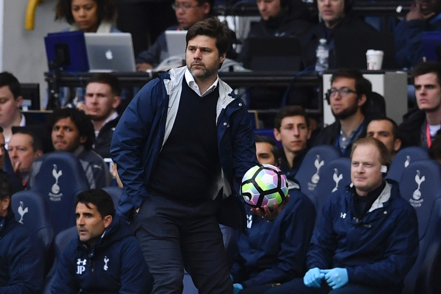 tottenham hotspur 039 s argentinian head coach mauricio pochettino throws the ball back in play during the english premier league football match between tottenham hotspur and arsenal at white hart lane in london on april 30 2017 photo afp