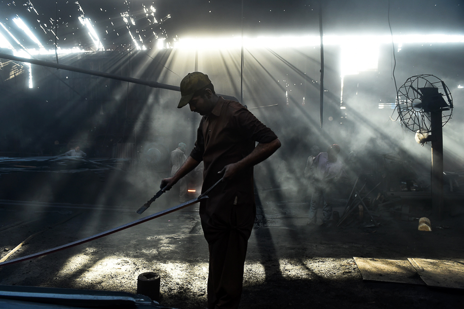 pakistani labourers work at an iron factory ahead of international workers 039 day in lahore photo afp