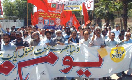 workers and activists participate in a labour day rally photo zafar aslam express