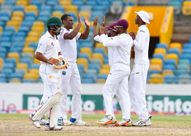 shannon gabriel 2l of west indies celebrates with teammates devendra bishoo c shai hope 2r and roston chase r following the dismissal of babar azam l of pakistan during the 2nd day of the 2nd test match between west indies and pakistan at kensington oval bridgetown barbados may 01 2017 photo afp shannon gabriel 2l of west indies celebrates with teammates devendra bishoo c shai hope 2r and roston chase r following the dismissal of babar azam l of pakistan during the 2nd day of the 2nd test match between west indies and pakistan at kensington oval bridgetown barbados may 01 2017 photo afp