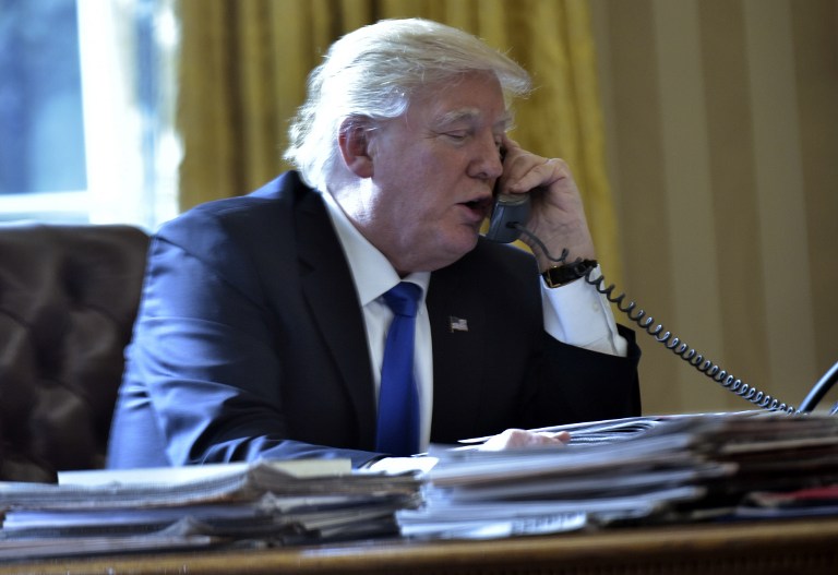 us president donald trump speaks on the phone with russia 039 s president vladimir putin from the oval office of the white house on january 28 2017 in washington dc photo afp