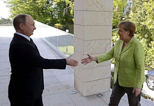 russian president vladimir putin welcomes german chancellor angela merkel during their meeting at the bocharov ruchei state residence in sochi photo afp russian president vladimir putin welcomes german chancellor angela merkel during their meeting at the bocharov ruchei state residence in sochi photo afp