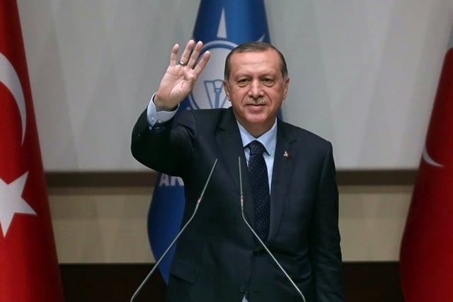 turkish president recep tayyip erdogan flashes a four finger sign called quot the rabia sign quot as he delivers a speech at the headquarters of the rulling ak party in ankara on may 2 2017 president recep tayyip erdogan on may 2 2017 photo afp