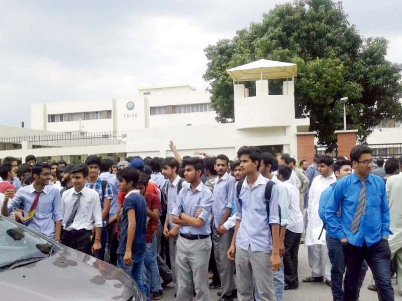 students gather outside the fibse building to stage a protest photo express