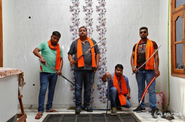 hindu yuva vahini members pose inside the vigilante group 039 s office in the city of unnao india photo reuters hindu yuva vahini members pose inside the vigilante group 039 s office in the city of unnao india photo reuters
