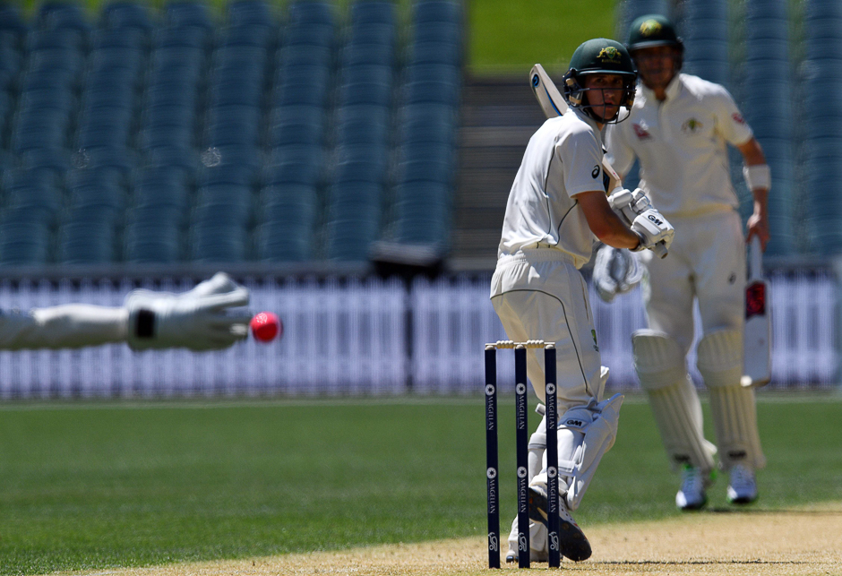 Cricket Australia XI batsman Nick Larkin watches his shot off England's paceman Chris Woakes on the second day of a four-day Ashes tour match at the Adelaide Oval in Adelaide. PHOTO: AFP