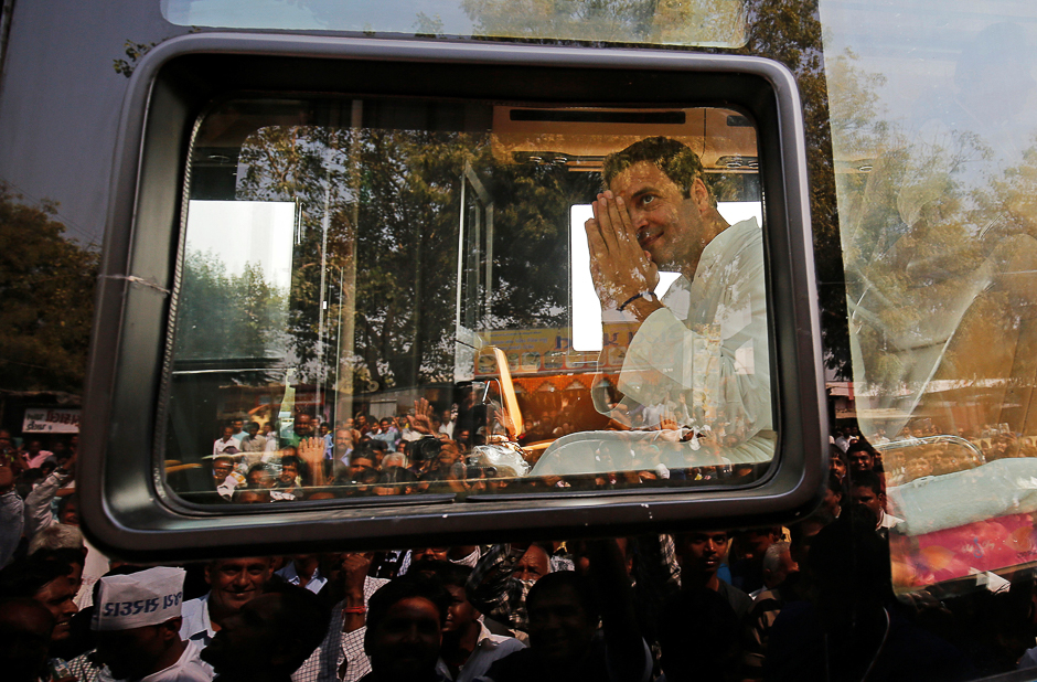 Rahul Gandhi, Vice-President of India's main opposition Congress Party, greets his supporters during a rally ahead of Gujarat state assembly elections, at a village on the outskirts of Ahmedabad, India. PHOTO: REUTERS
