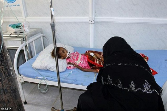 a yemeni mother tends to her malnourished child at a hospital in the port city of hodeida photo afp