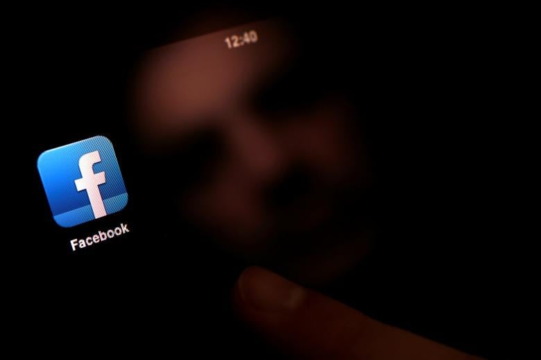 file photo a man uses an ipad with a facebook app in this photo illustration in sofia bulgaria on january 30 2013 photo reuters