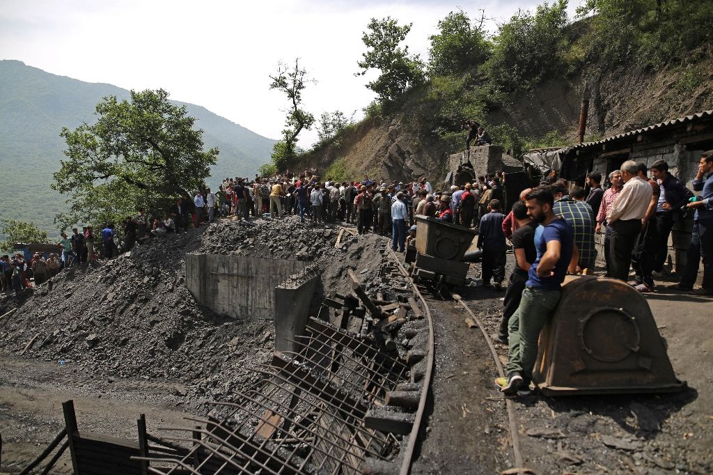 miners and rescue workers gather at the scene following an explosion in a coal mine in azadshahr in northern iran on may 3 2017 photo afp